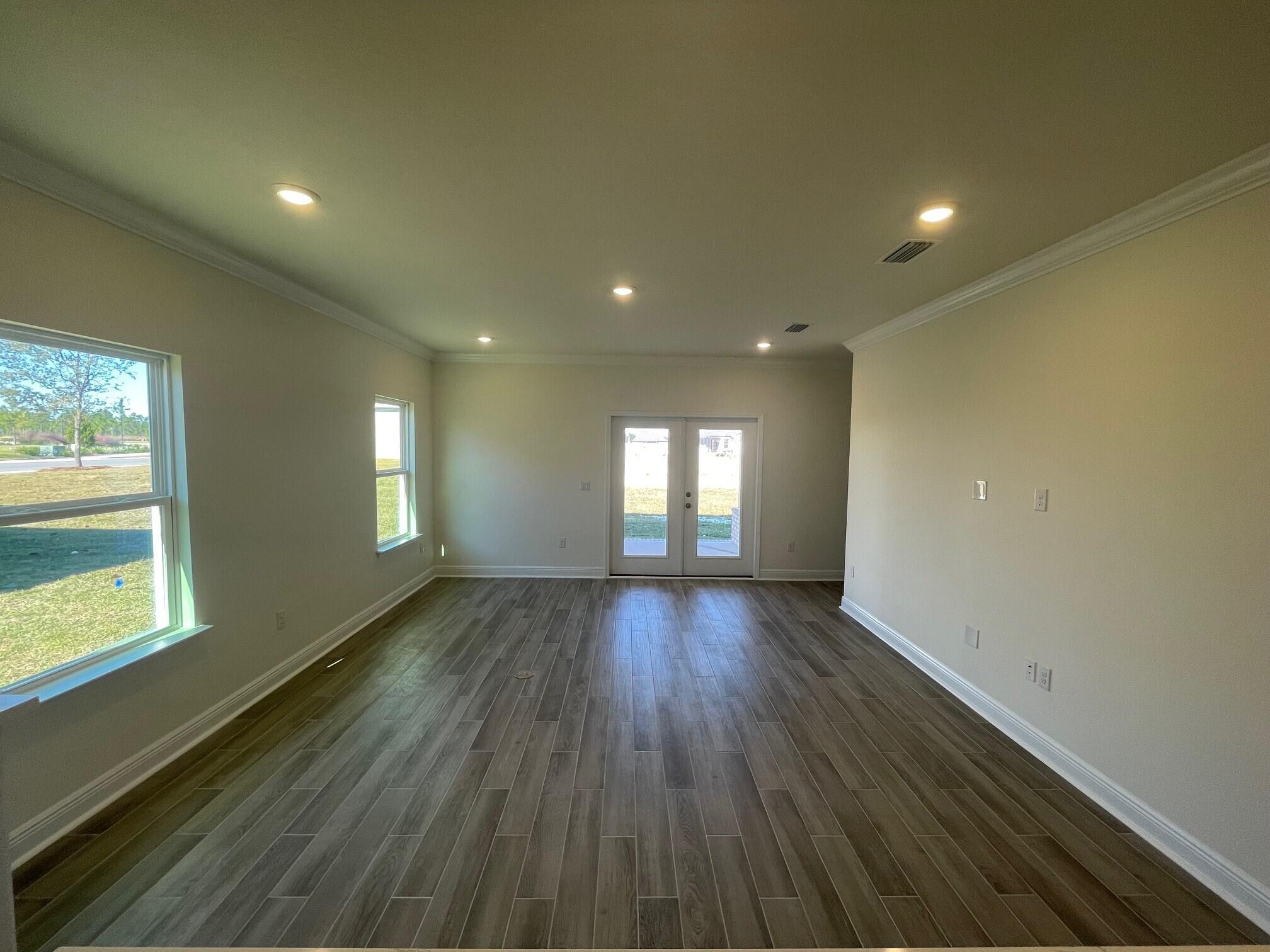 23 Splendor Run Ponce de Leon, FL 32455 - Photo 4 of 8 a view of empty room with window and wooden floor