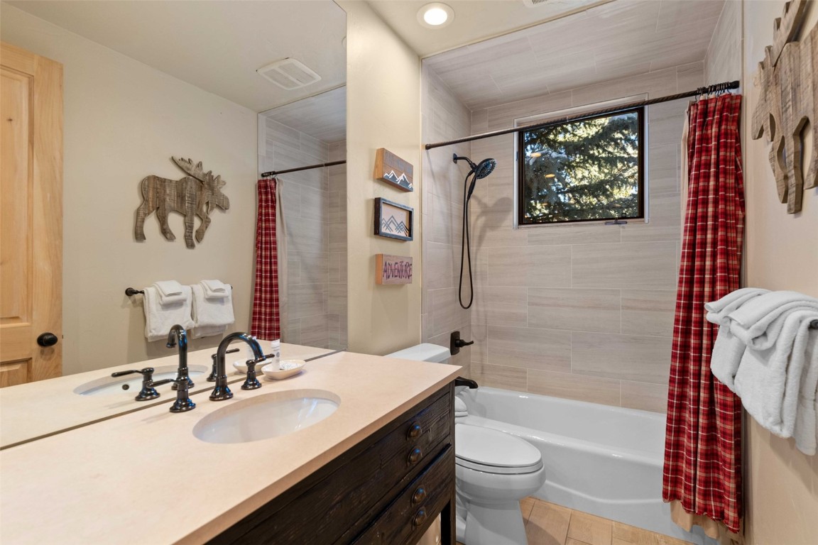1459 East Keystone Road, Unit C1 Dillon, CO 80435 - Photo 23 of 27 Full bathroom featuring shower/tub combo, upgraded vanity