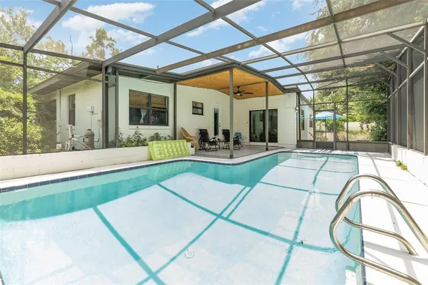 a view of swimming pool with a patio