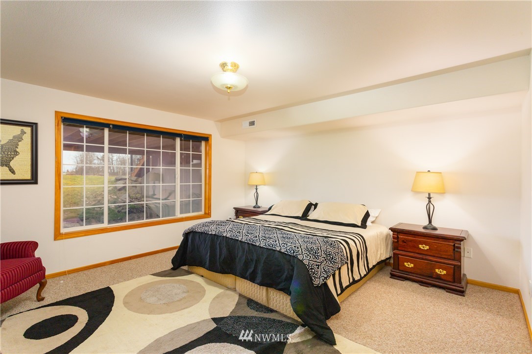 8416 Delta Line Road Custer, WA 98240 - Photo 19 of 40 a bedroom with a bed and a window