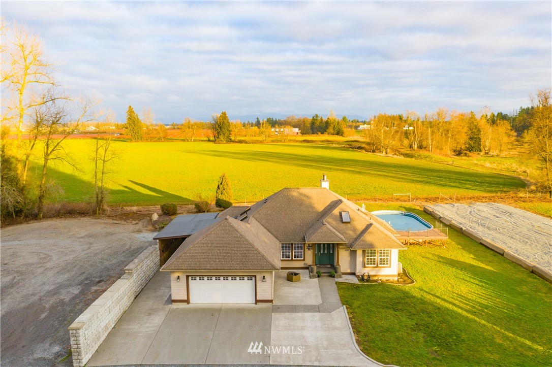 8416 Delta Line Road Custer, WA 98240 - Photo 3 of 40 a view of a swimming pool with an ocean view