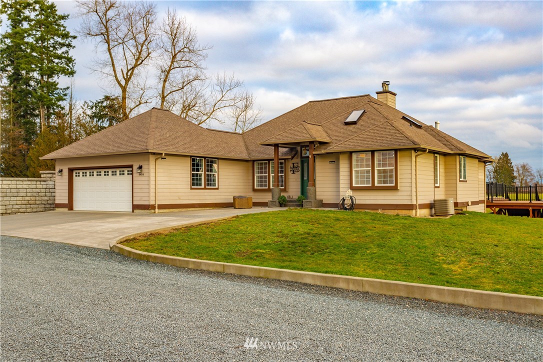 8416 Delta Line Road Custer, WA 98240 - Photo 4 of 40 a front view of a house with a garden