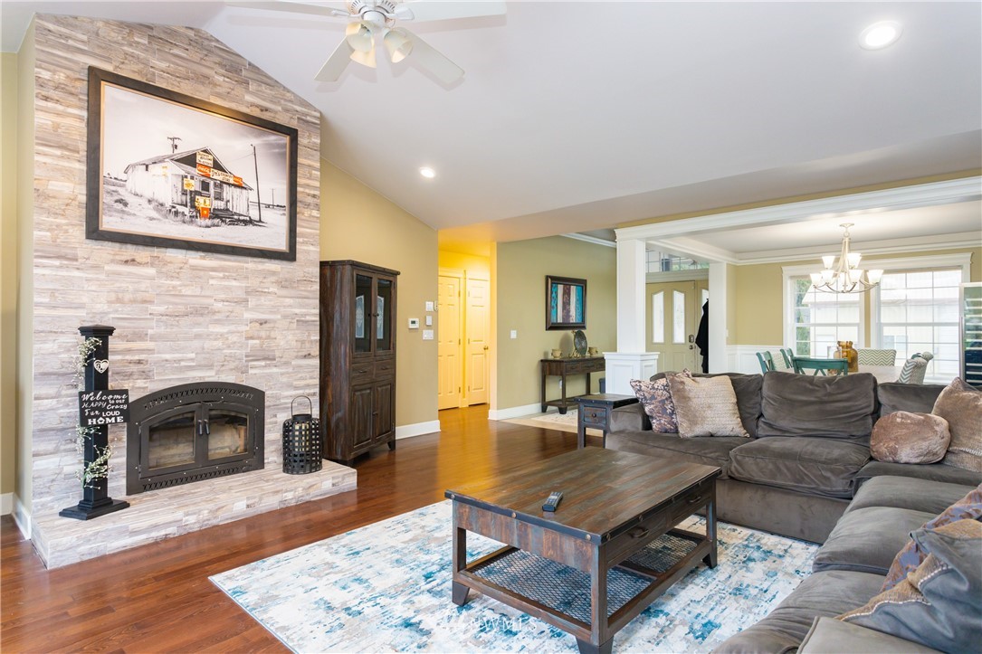 8416 Delta Line Road Custer, WA 98240 - Photo 5 of 40 a living room with furniture a fireplace and a table