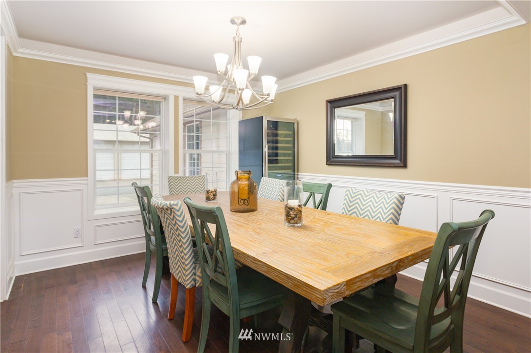 8416 Delta Line Road Custer, WA 98240 - Photo 7 of 40 a view of a dining room with furniture window and wooden floor