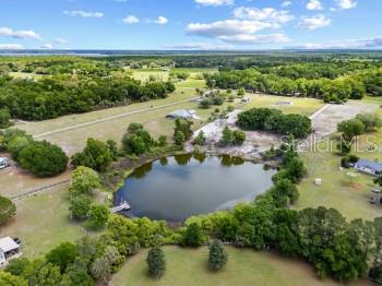 42415 Big Oak Road Altoona, FL 32702 - Photo 3 of 19 an aerial view of a houses with a yard