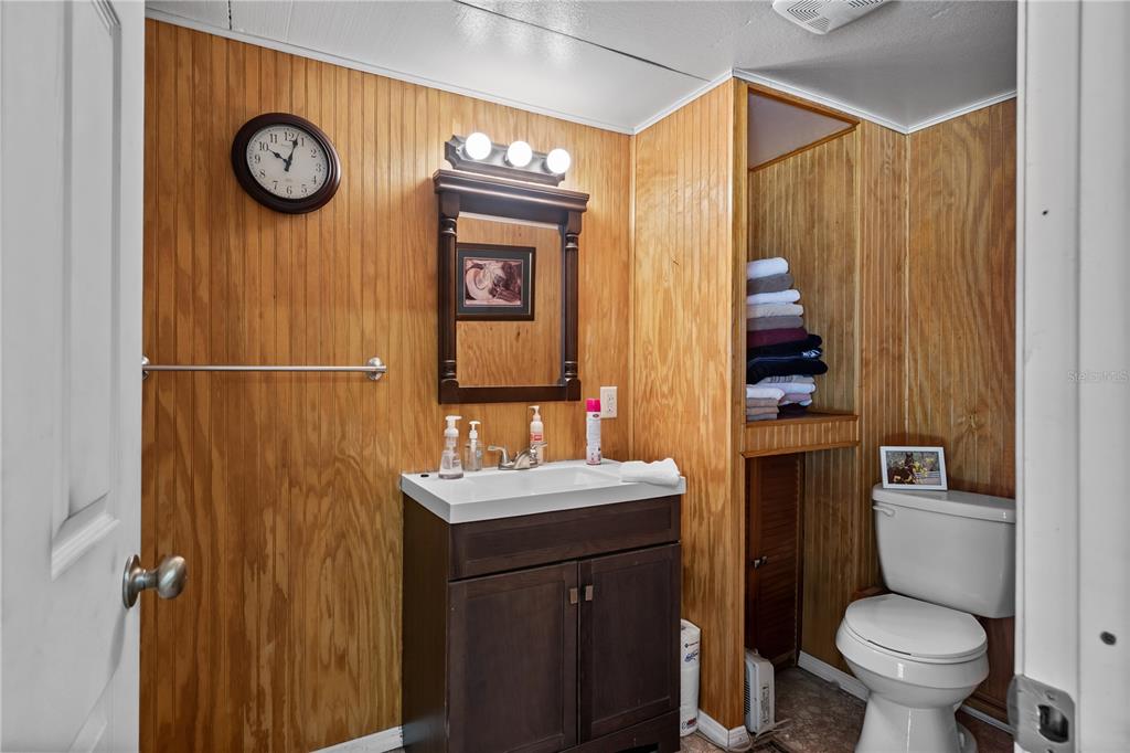 42415 Big Oak Road Altoona, FL 32702 - Photo 6 of 19 a bathroom with a sink a toilet and a shower