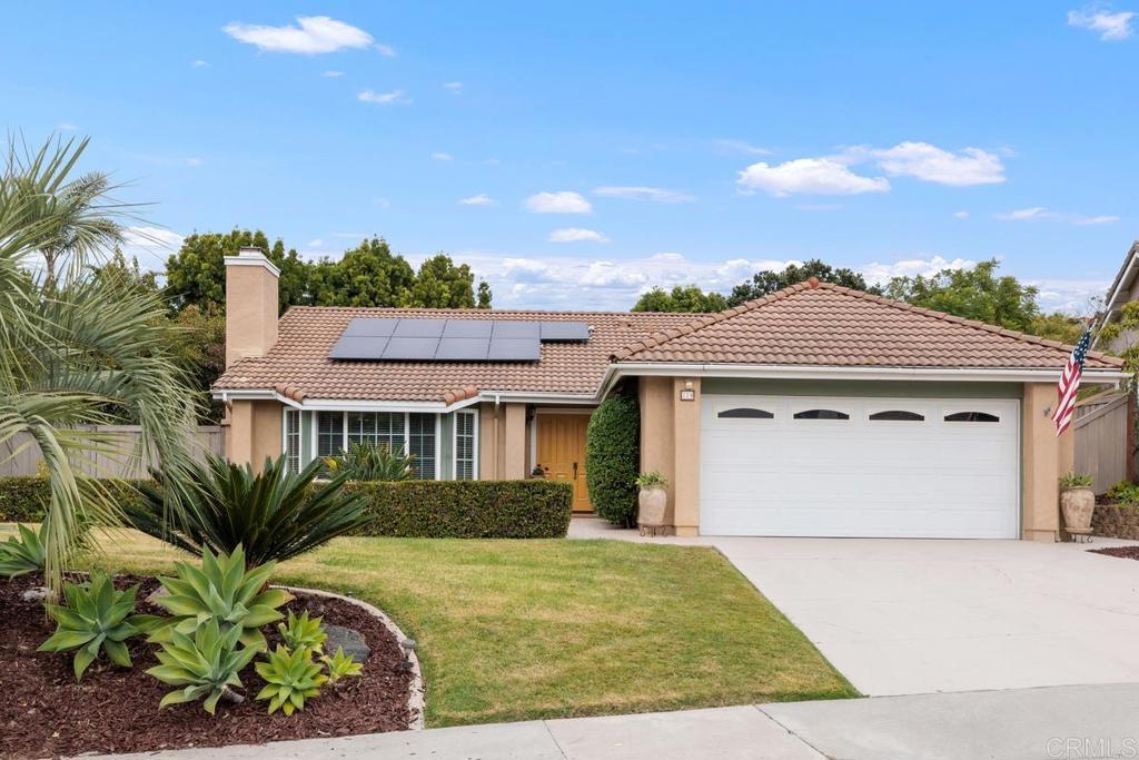 774 Fieldstone Lane Encinitas, CA 92024 - Photo 1 of 1 a view of a white house with a yard and potted plants