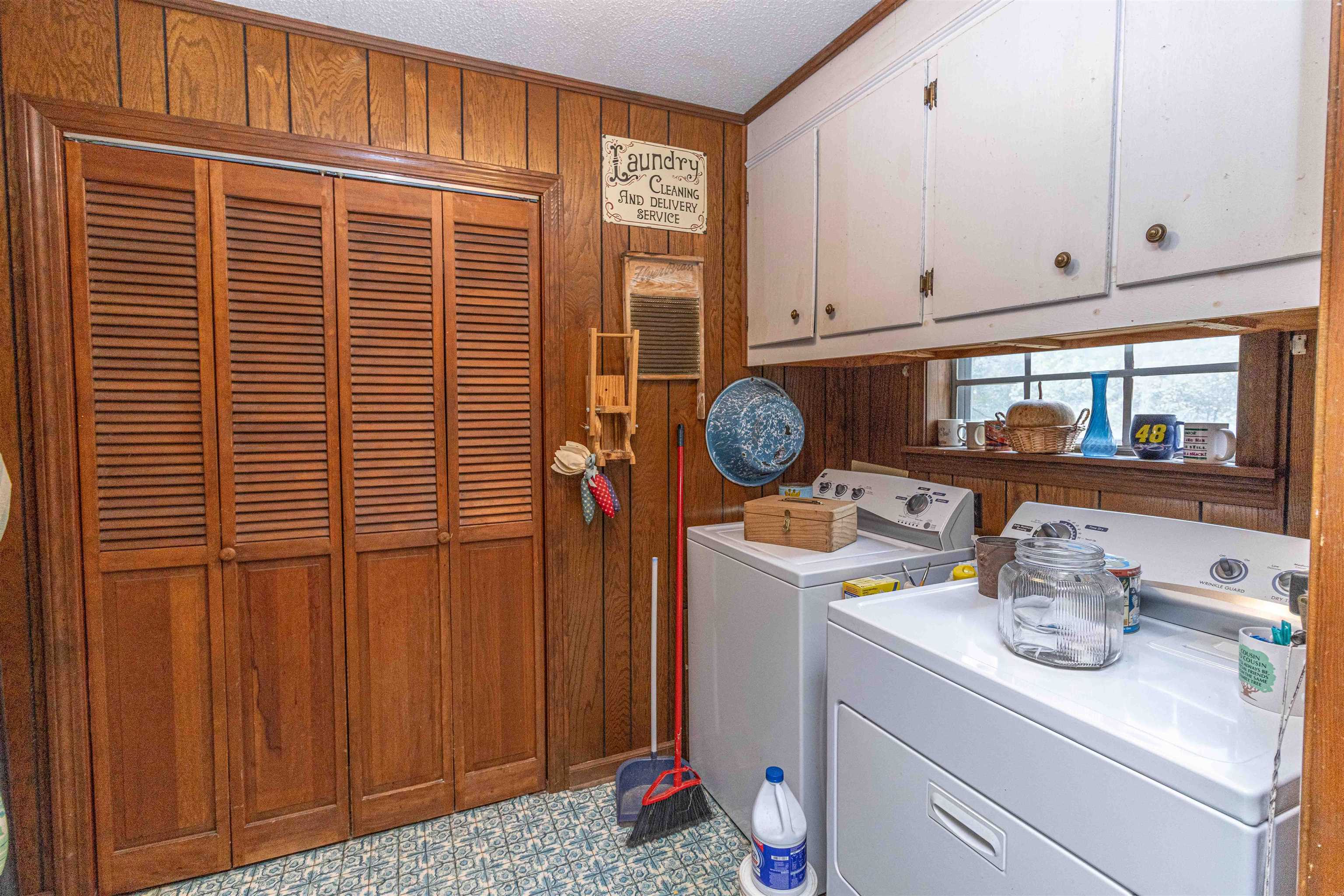260 Mitchell Street Selmer, TN 38375 - Photo 17 of 22 a kitchen with a sink cabinets and utility room