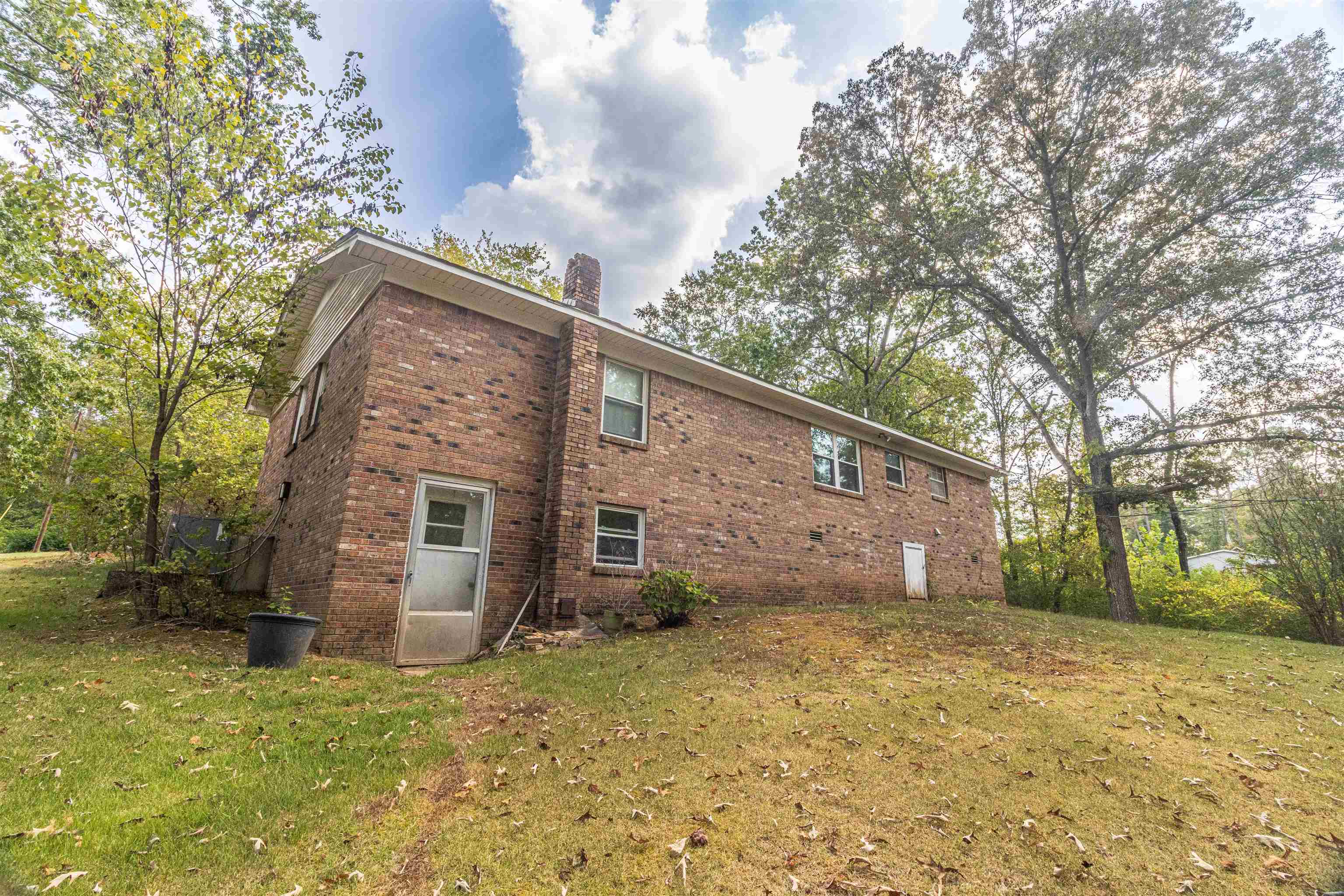 260 Mitchell Street Selmer, TN 38375 - Photo 19 of 22 a view of a house with a yard