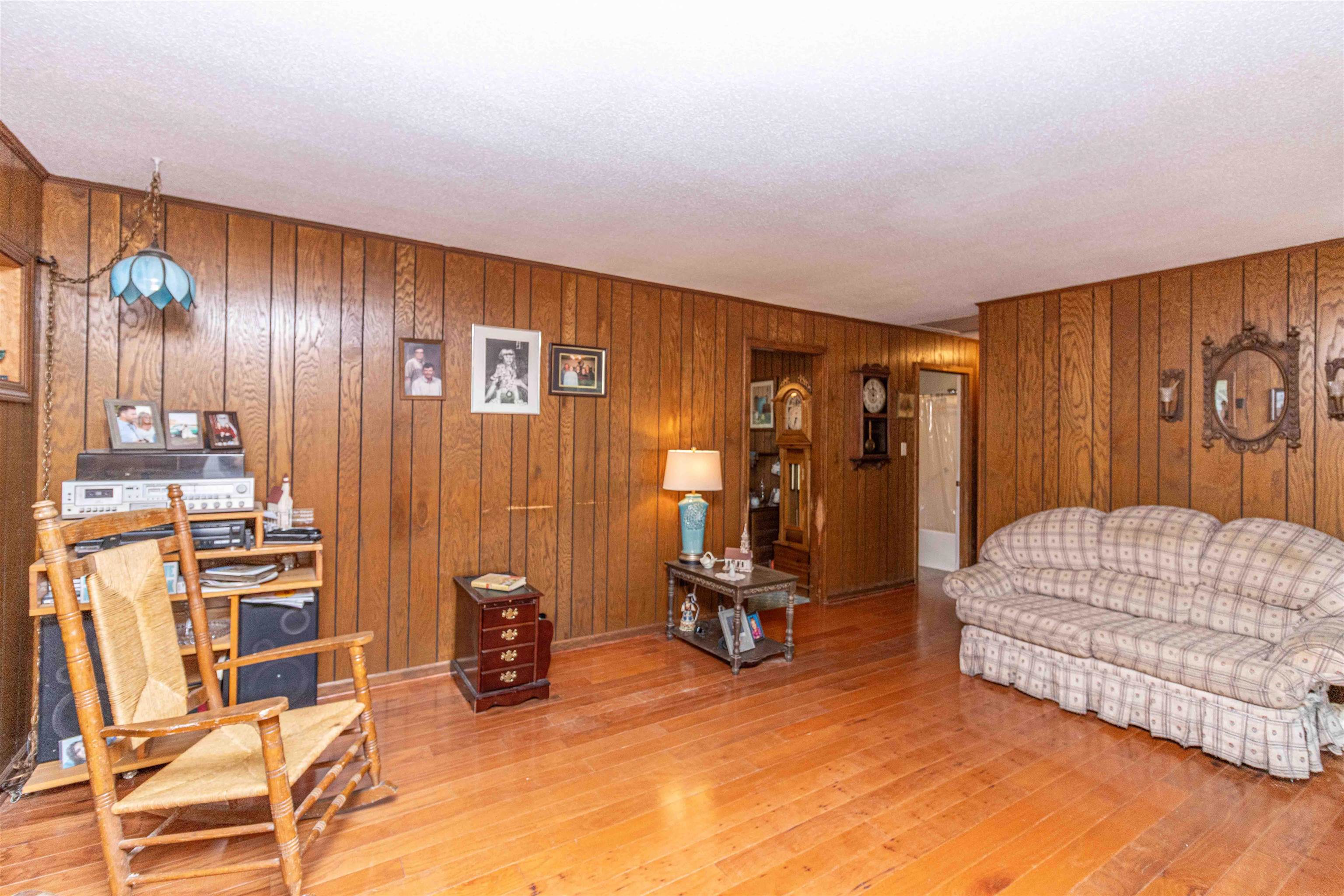 260 Mitchell Street Selmer, TN 38375 - Photo 5 of 22 a bedroom with a bed a couch and dresser