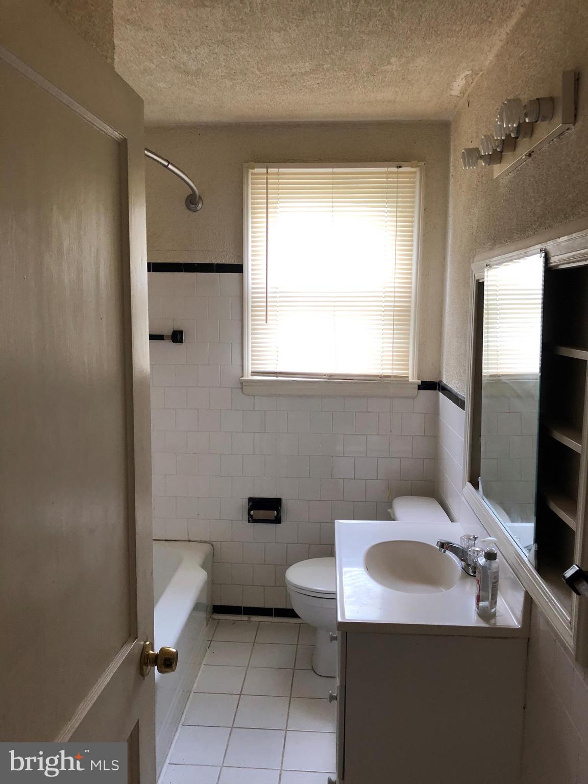 3710 Springwood Avenue Baltimore, MD 21206 - Photo 10 of 12 a bathroom with a sink toilet and shower