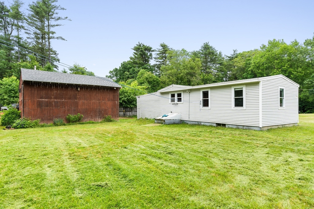 24 Horton Road Orange, MA 01364 - Photo 21 of 32 a view of a backyard with a garden