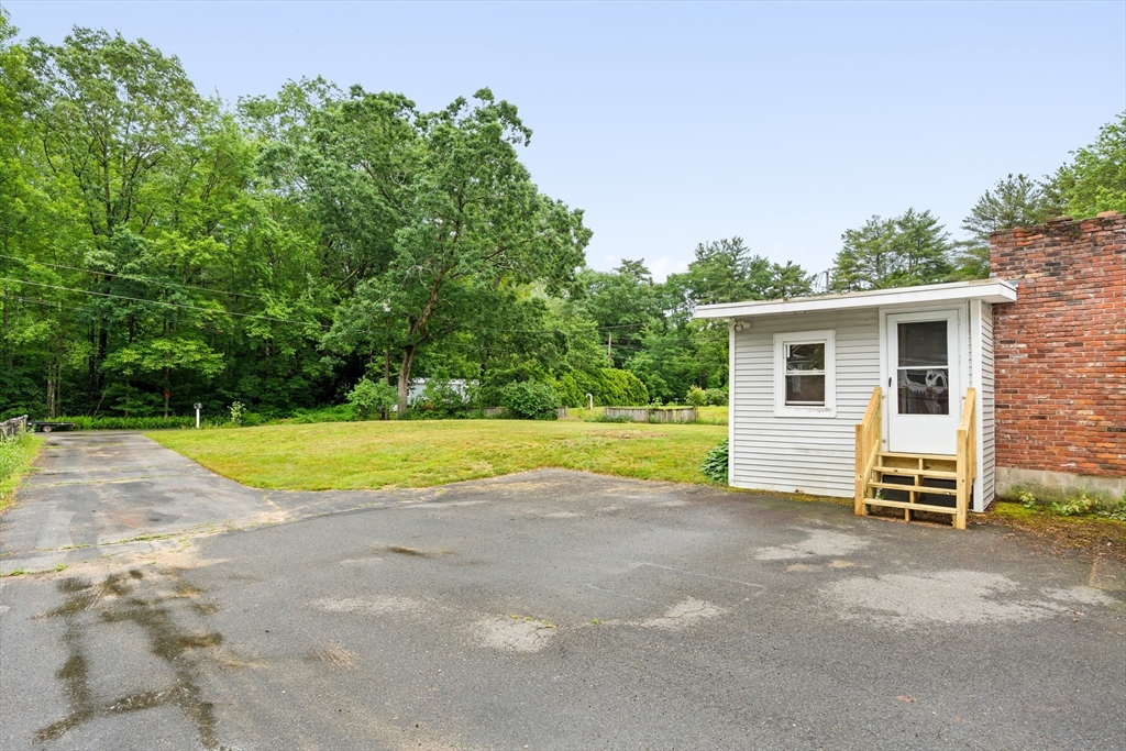 24 Horton Road Orange, MA 01364 - Photo 24 of 32 a view of a house with backyard and swimming pool