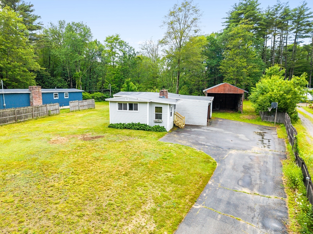 24 Horton Road Orange, MA 01364 - Photo 26 of 32 a view of a swimming pool with an outdoor seating and a yard