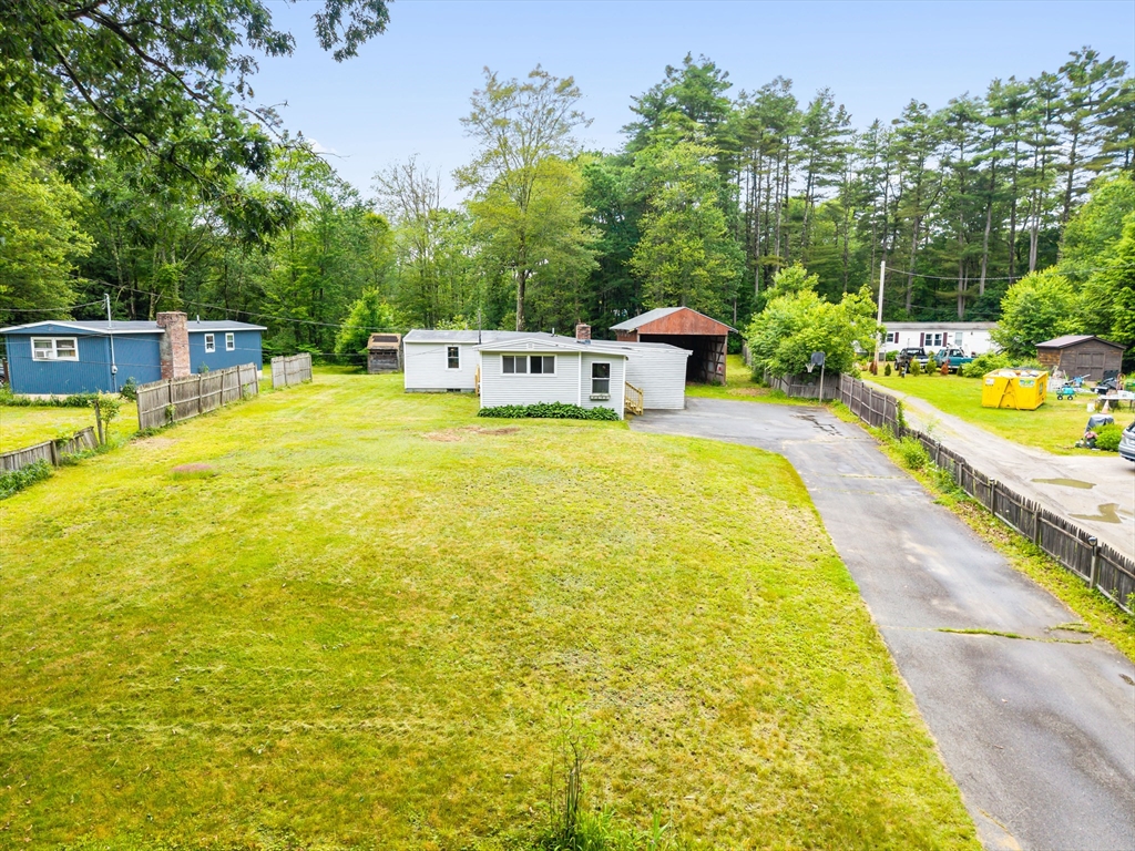 24 Horton Road Orange, MA 01364 - Photo 27 of 32 a swimming pool with trees in the background