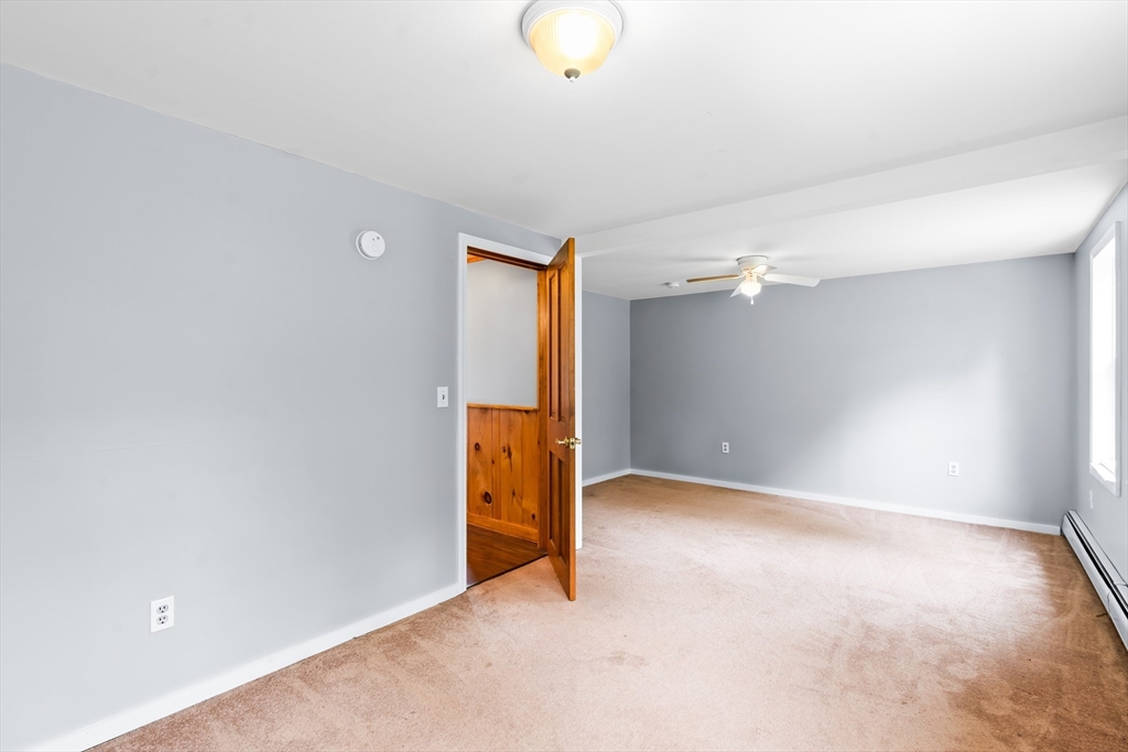 24 Horton Road Orange, MA 01364 - Photo 8 of 32 a view of an empty room with a window