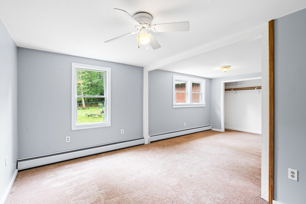 24 Horton Road Orange, MA 01364 - Photo 9 of 32 an empty room with windows and closet