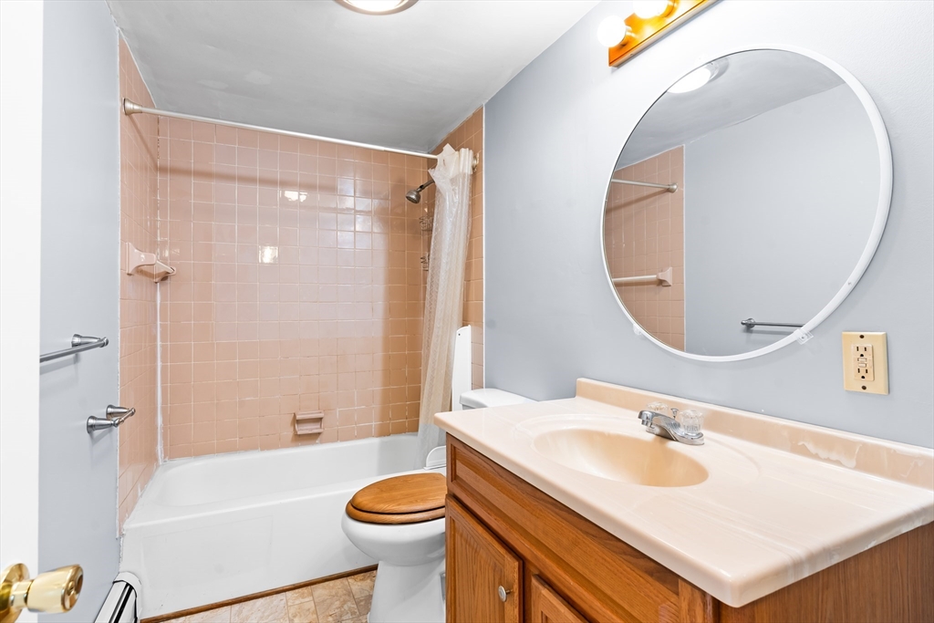 24 Horton Road Orange, MA 01364 - Photo 10 of 32 a bathroom with a sink a toilet and a mirror