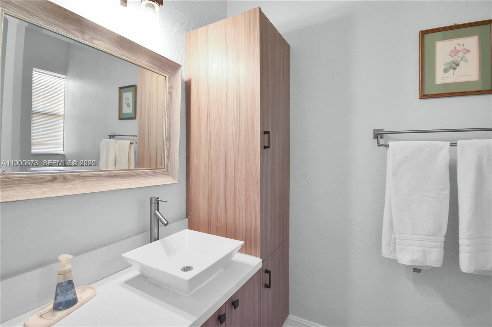 16541 Southwest 62nd Street Southwest Ranches, FL 33331 - Photo 27 of 37 a bathroom with a sink toilet and vanity