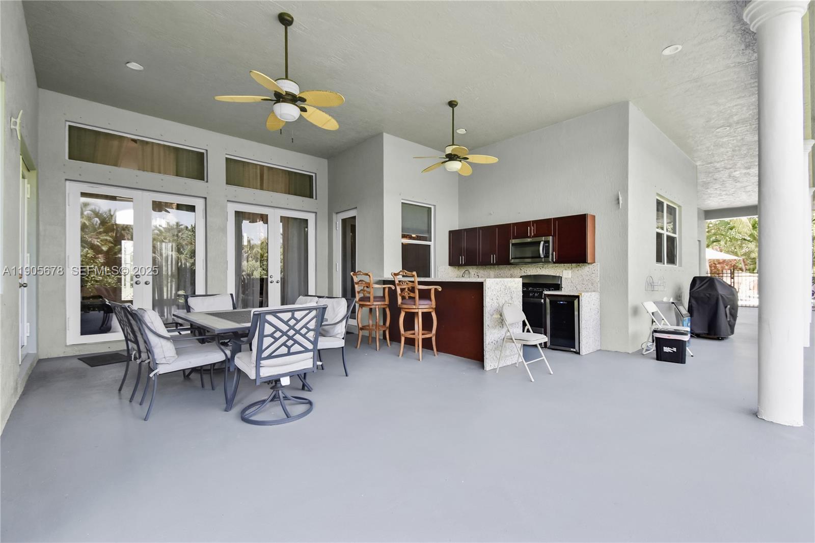 16541 Southwest 62nd Street Southwest Ranches, FL 33331 - Photo 28 of 37 a living room with furniture a fireplace and a flat screen tv