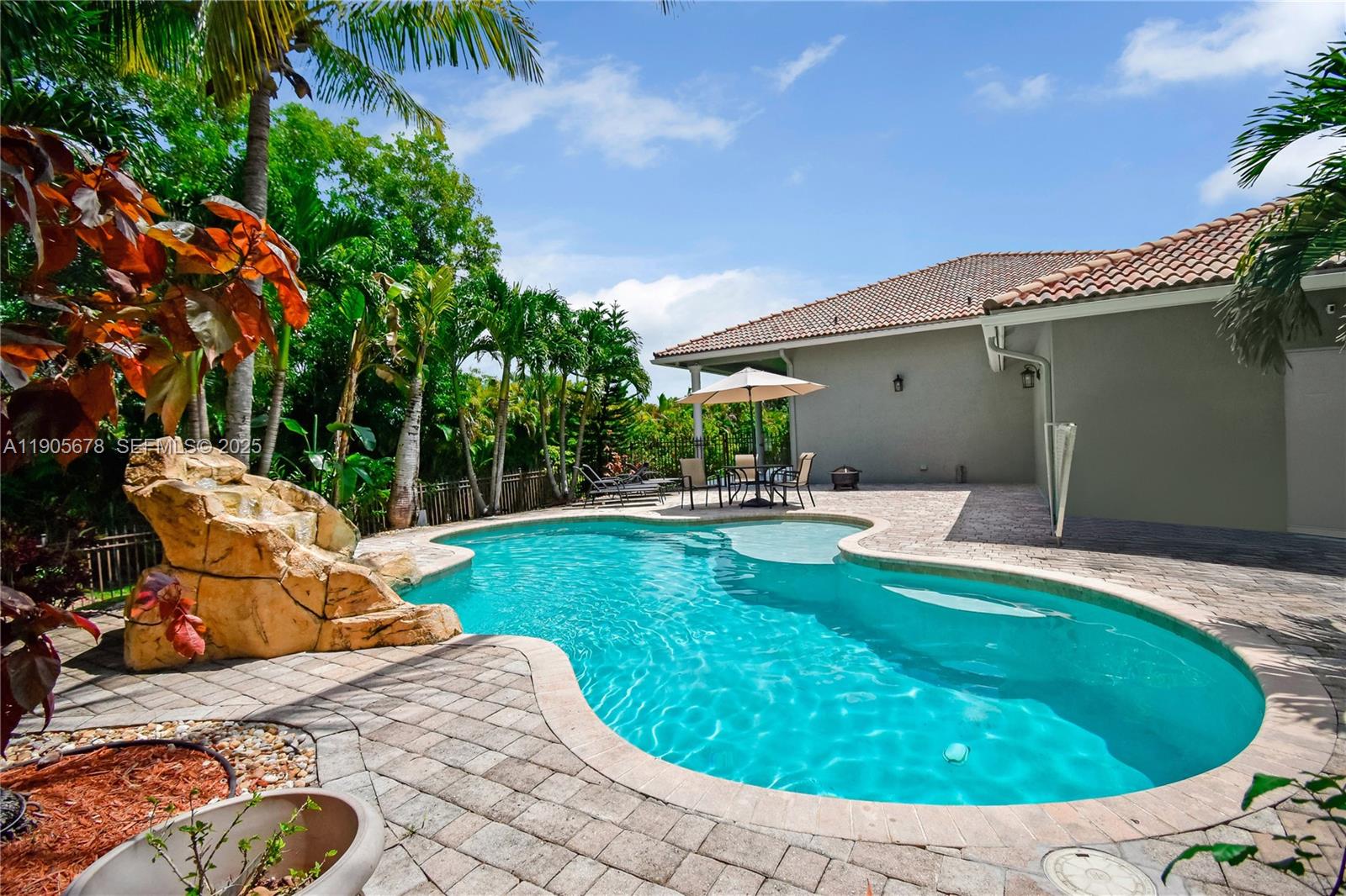 16541 Southwest 62nd Street Southwest Ranches, FL 33331 - Photo 30 of 37 a view of a swimming pool with a lounge chair