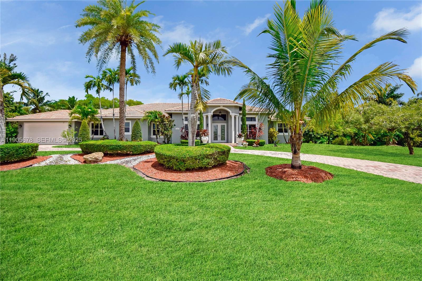 16541 Southwest 62nd Street Southwest Ranches, FL 33331 - Photo 33 of 37 a front view of a house with swimming pool and green space