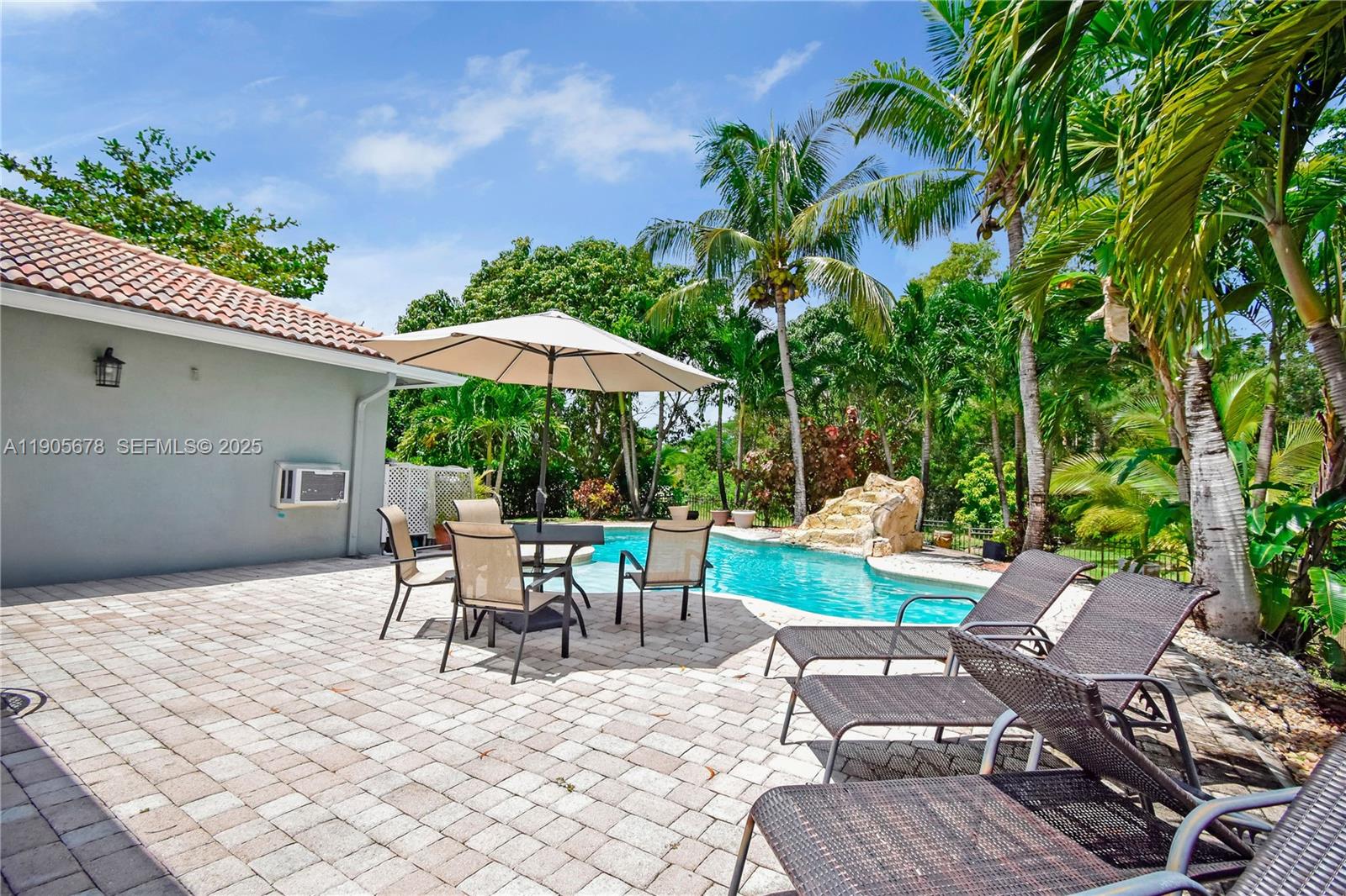 16541 Southwest 62nd Street Southwest Ranches, FL 33331 - Photo 4 of 37 a view of backyard with outdoor seating and green space