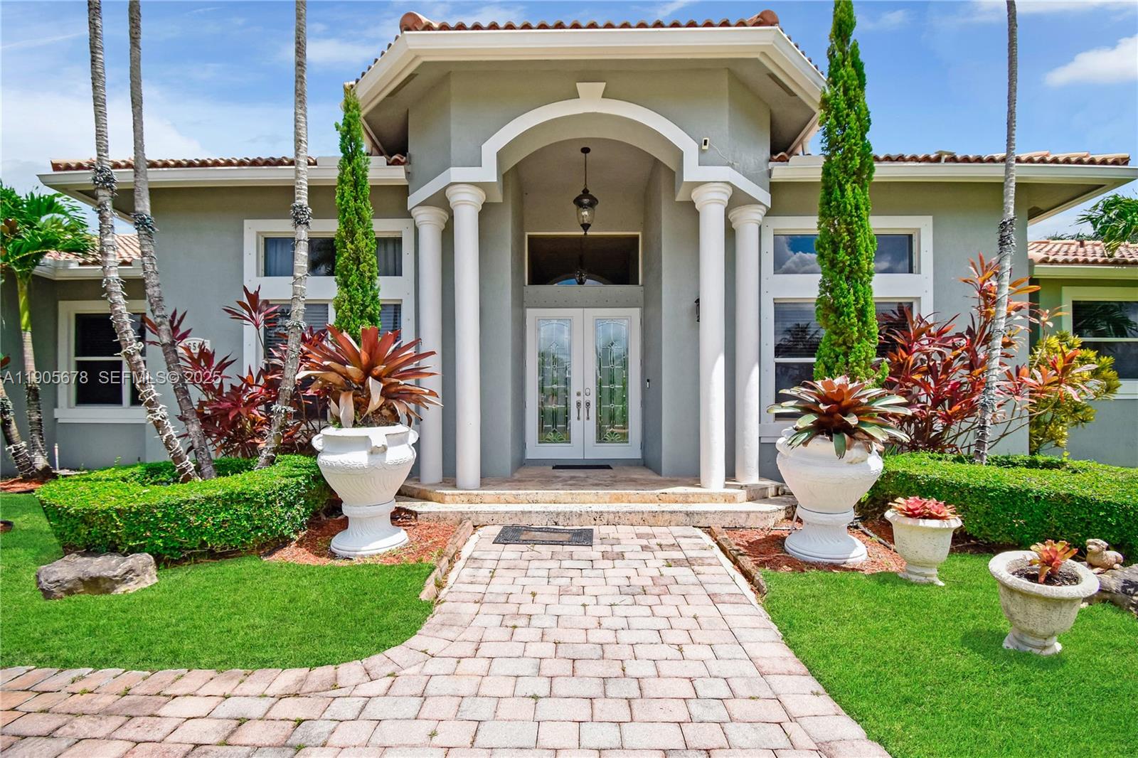 16541 Southwest 62nd Street Southwest Ranches, FL 33331 - Photo 7 of 37 a front view of a house with garden