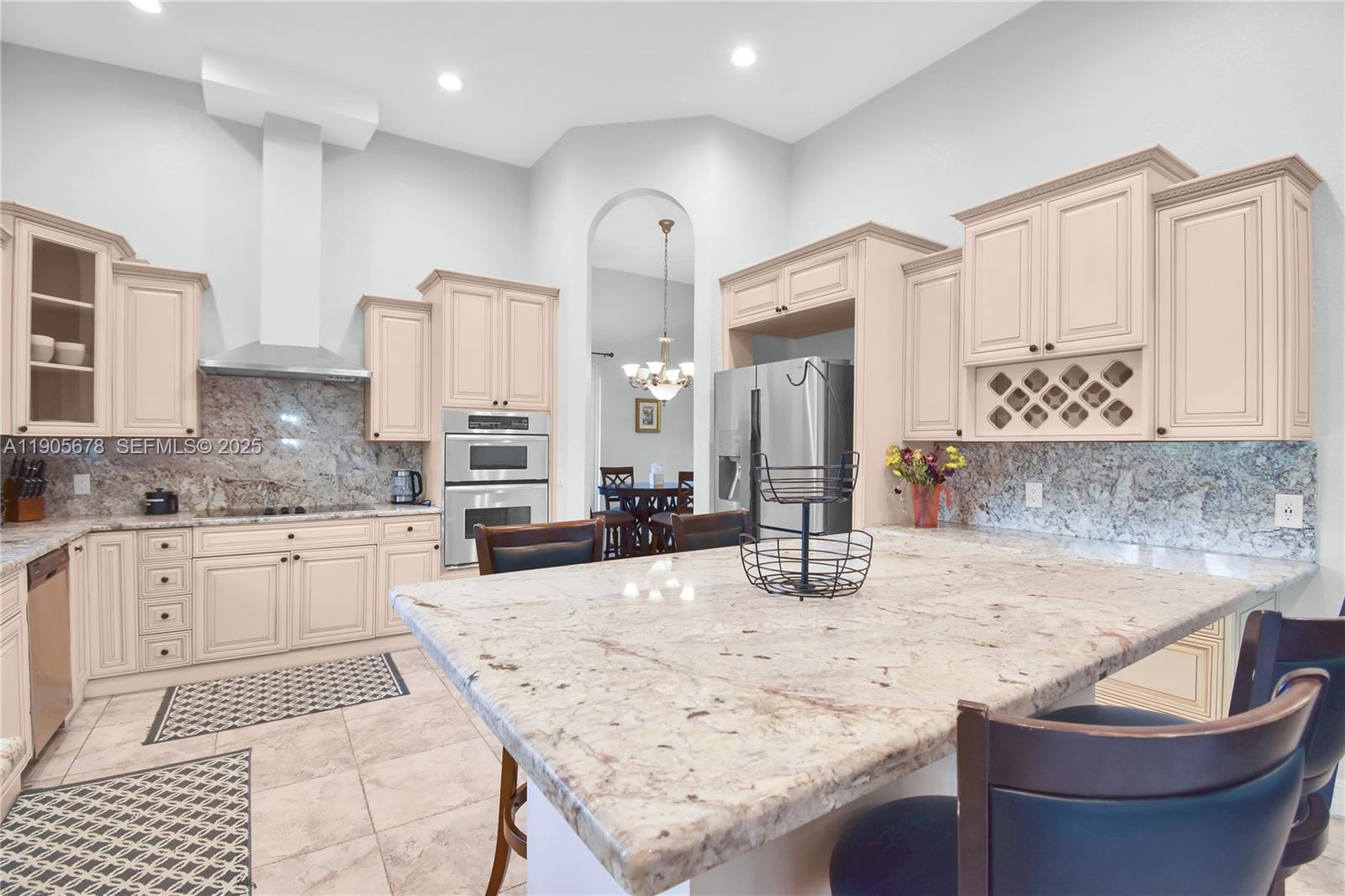 16541 Southwest 62nd Street Southwest Ranches, FL 33331 - Photo 8 of 37 a kitchen with stainless steel appliances granite countertop a sink and cabinets