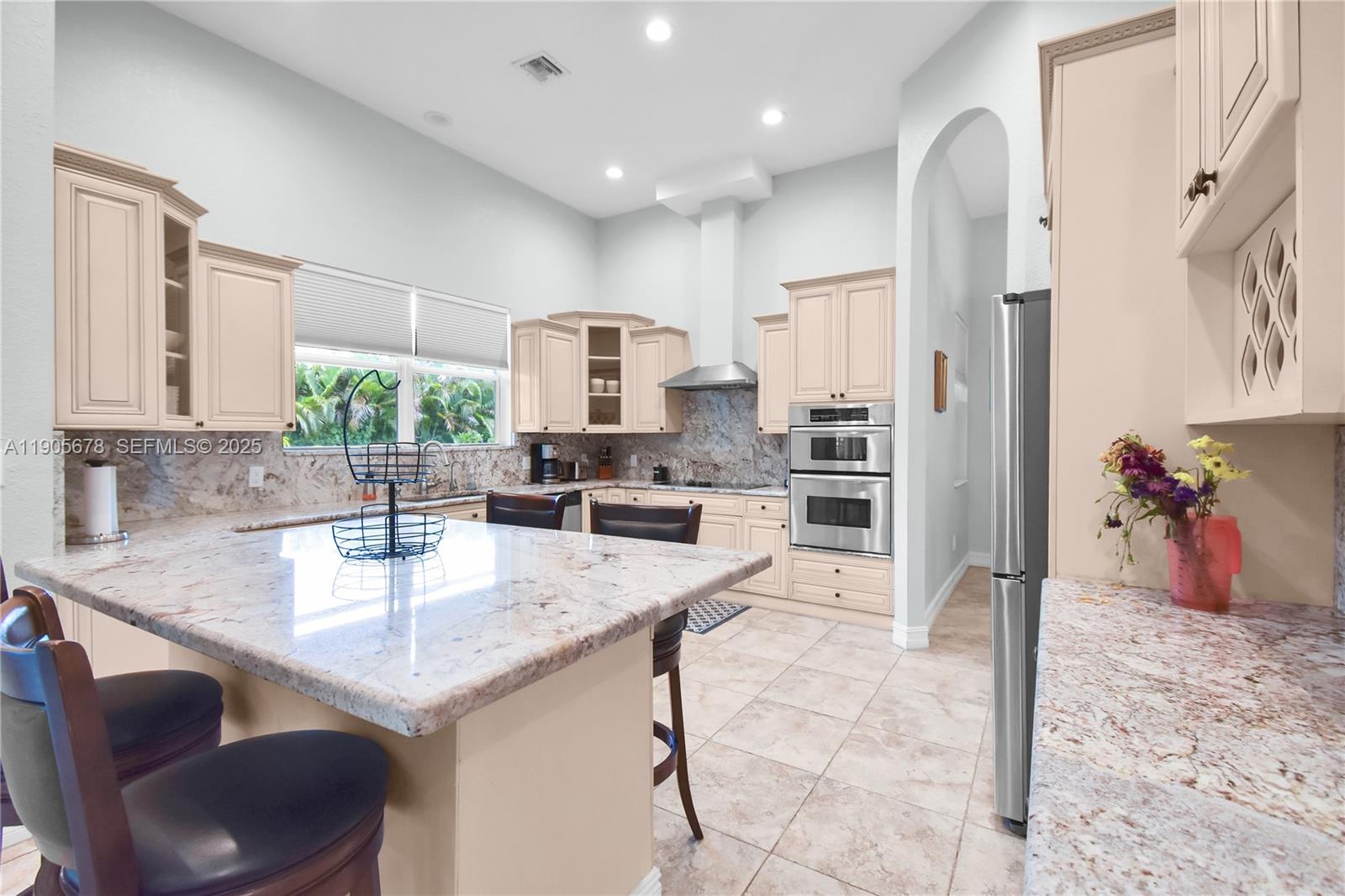 16541 Southwest 62nd Street Southwest Ranches, FL 33331 - Photo 9 of 37 a kitchen with stainless steel appliances granite countertop a sink refrigerator and cabinets