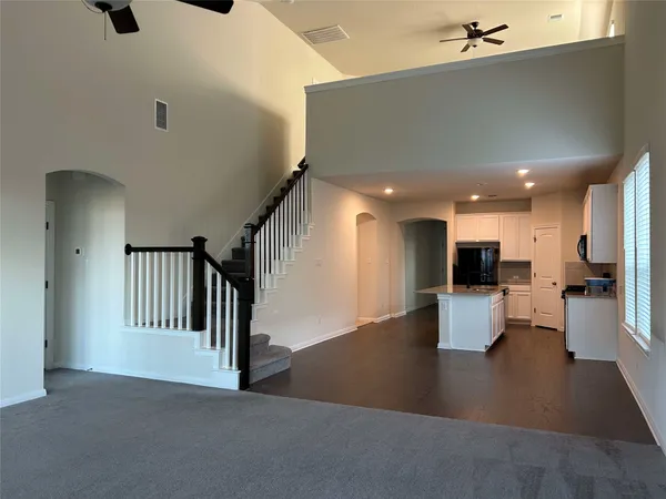 a kitchen with kitchen island and stainless steel appliances