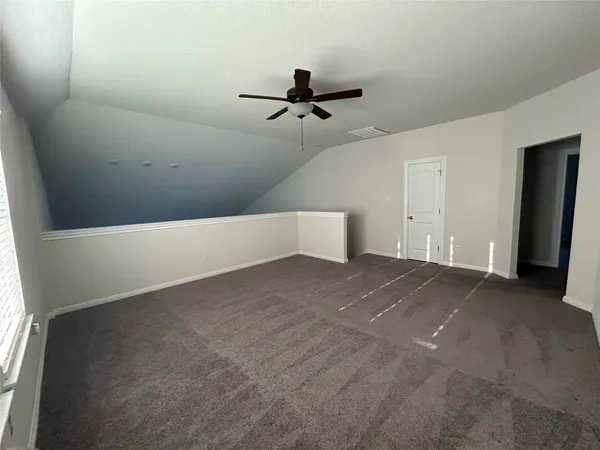 an empty room with a empty space and windows