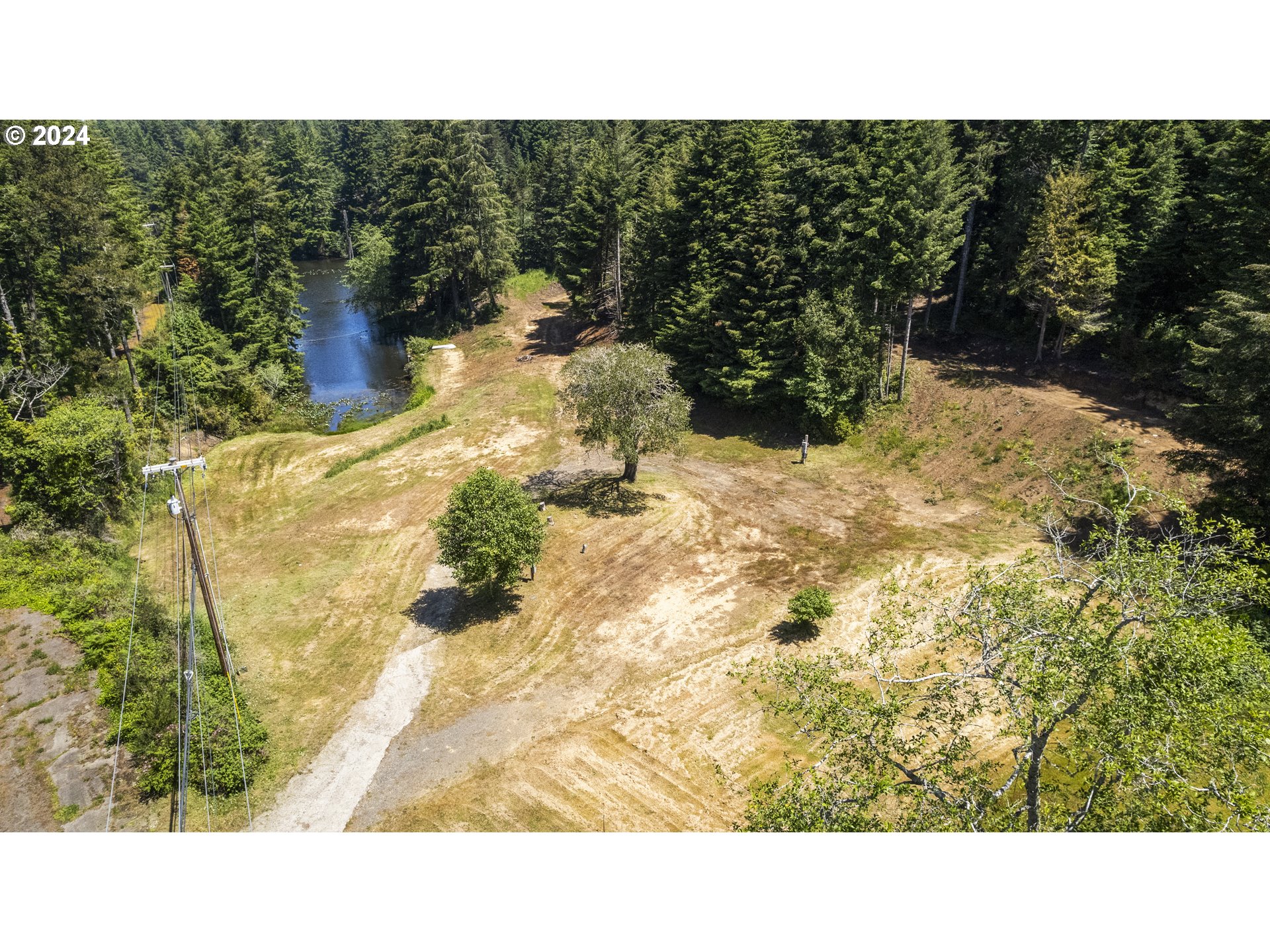 69919 Riddling Road North Bend, OR 97459 - Photo 14 of 28 a black and white photo of a lake