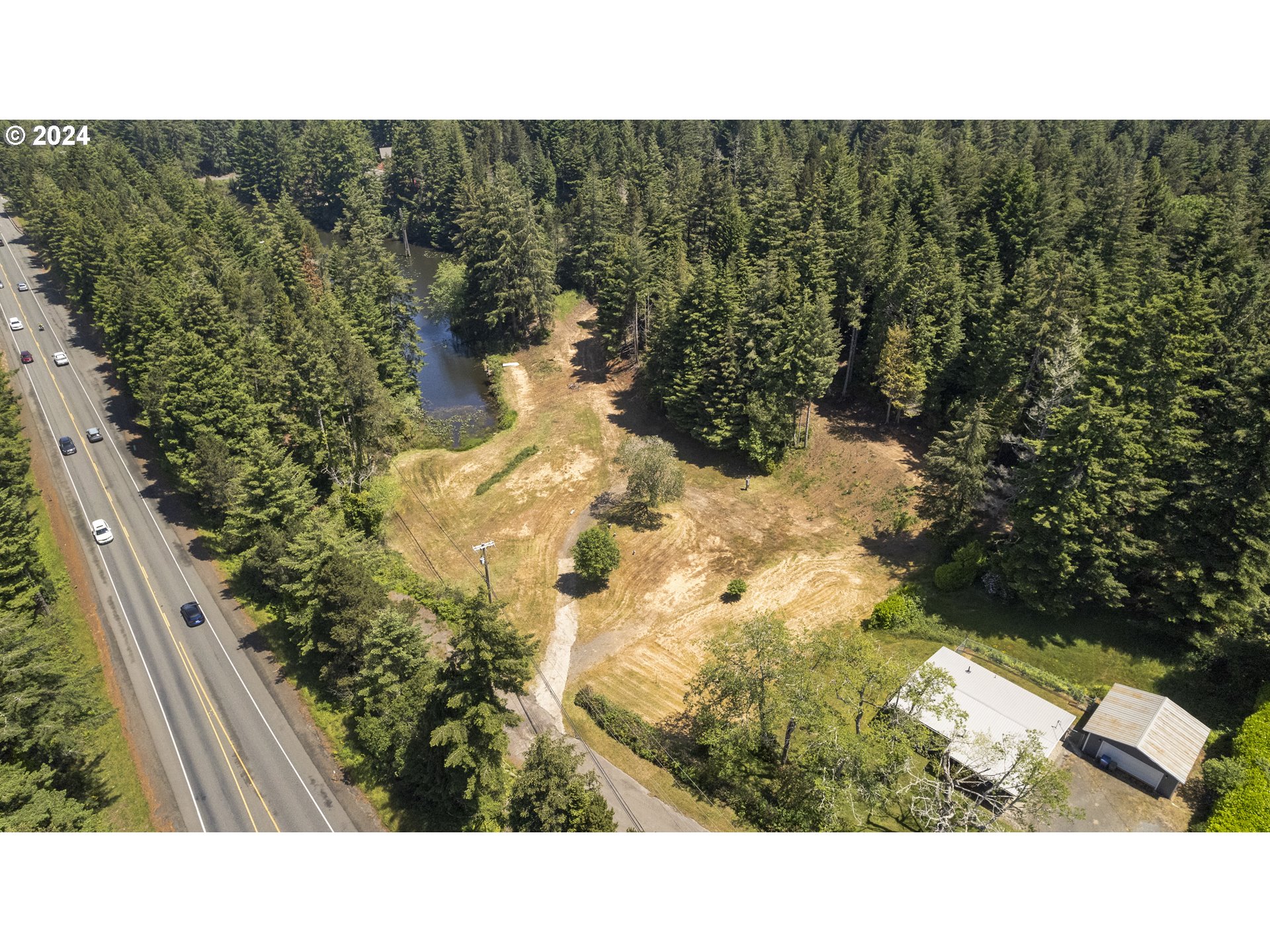 69919 Riddling Road North Bend, OR 97459 - Photo 15 of 28 a black and white photo of a house