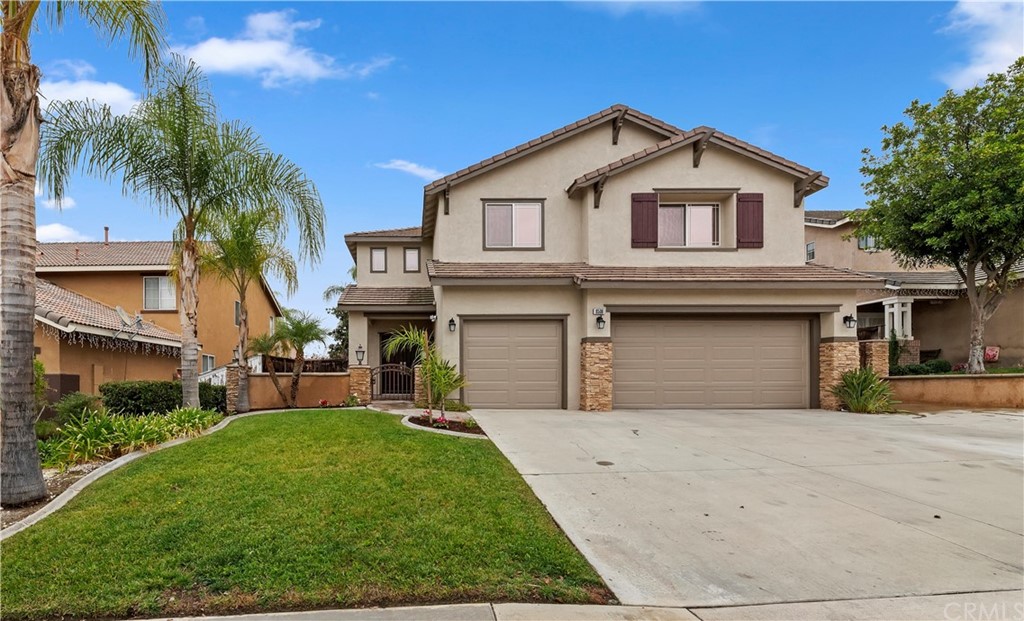 8506 Lindenhurst Street Riverside, CA 92508 - Photo 1 of 1 a front view of a house with a yard and garage
