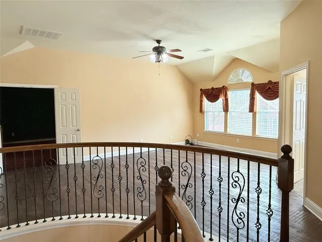a view of a balcony with wooden floor