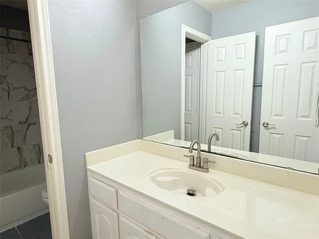 a bathroom with a bathtub and shower