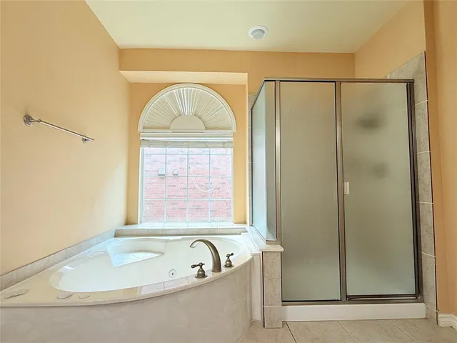 a view of a house with a garden and plants