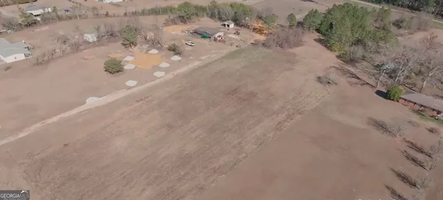 a view of a dry yard with a road