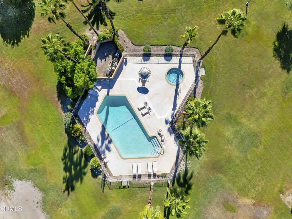an aerial view of a house with a swimming pool