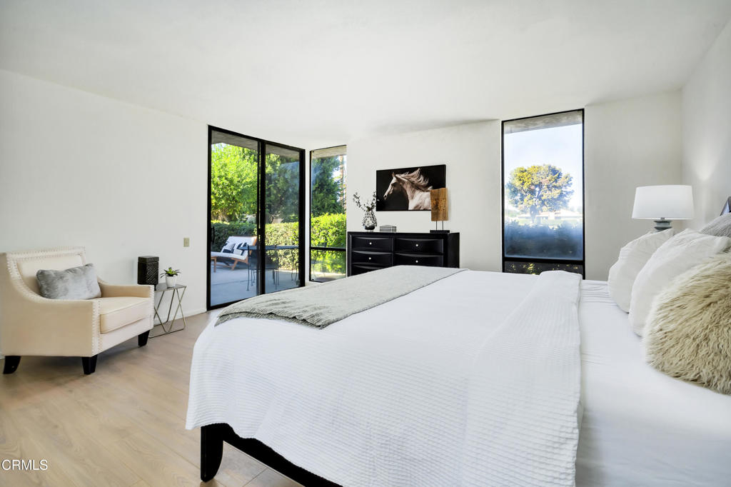 72460 Rodeo Way Rancho Mirage, CA 92270 - Photo 14 of 40 a bedroom with a bed and a large window