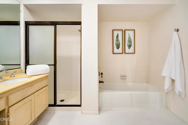 a bathroom with a bathtub and a sink