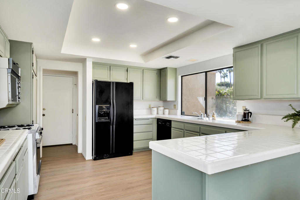 72460 Rodeo Way Rancho Mirage, CA 92270 - Photo 21 of 40 a kitchen with a sink stove and refrigerator