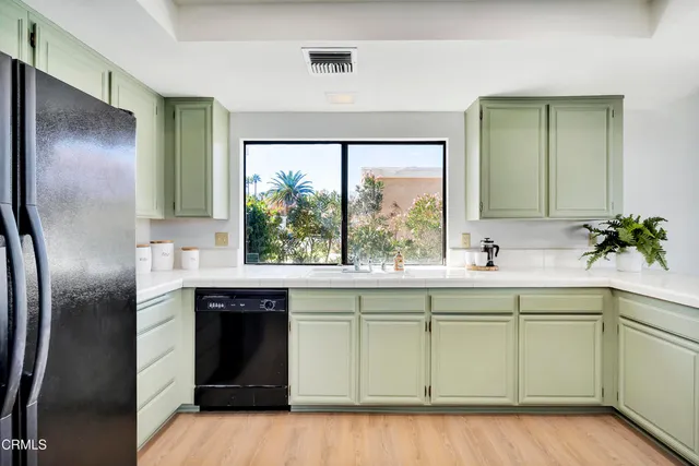 a kitchen with a sink and cabinets