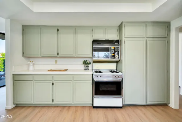 a utility room with sink dryer and washer