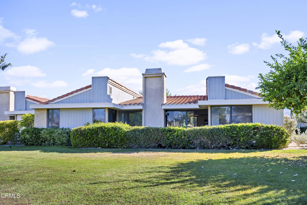 72460 Rodeo Way Rancho Mirage, CA 92270 - Photo 39 of 40 a front view of a house with a yard and potted plants