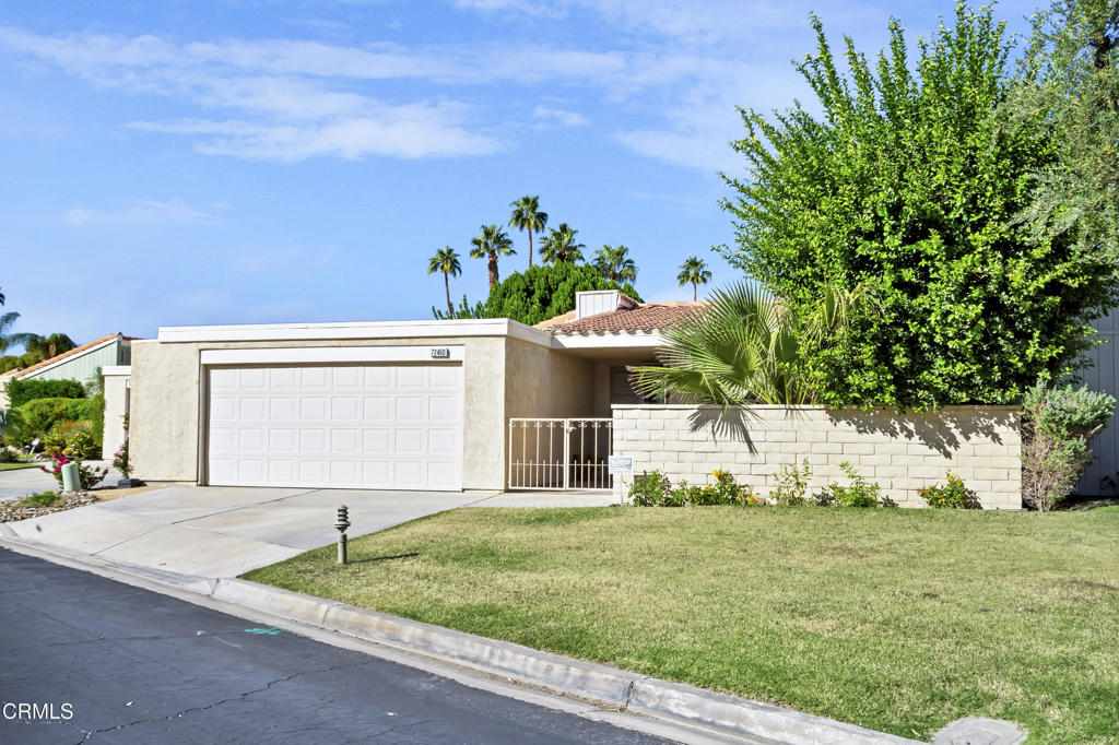 72460 Rodeo Way Rancho Mirage, CA 92270 - Photo 40 of 40 a front view of a house with a yard and garage