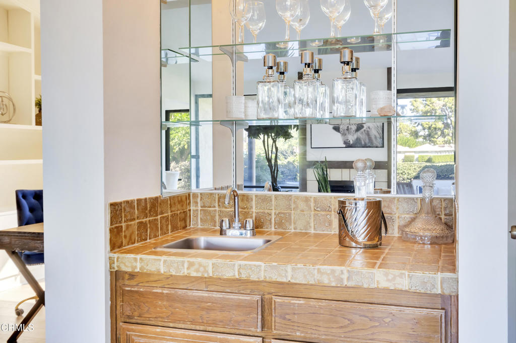 72460 Rodeo Way Rancho Mirage, CA 92270 - Photo 10 of 40 a bathroom with a granite countertop sink and a large mirror