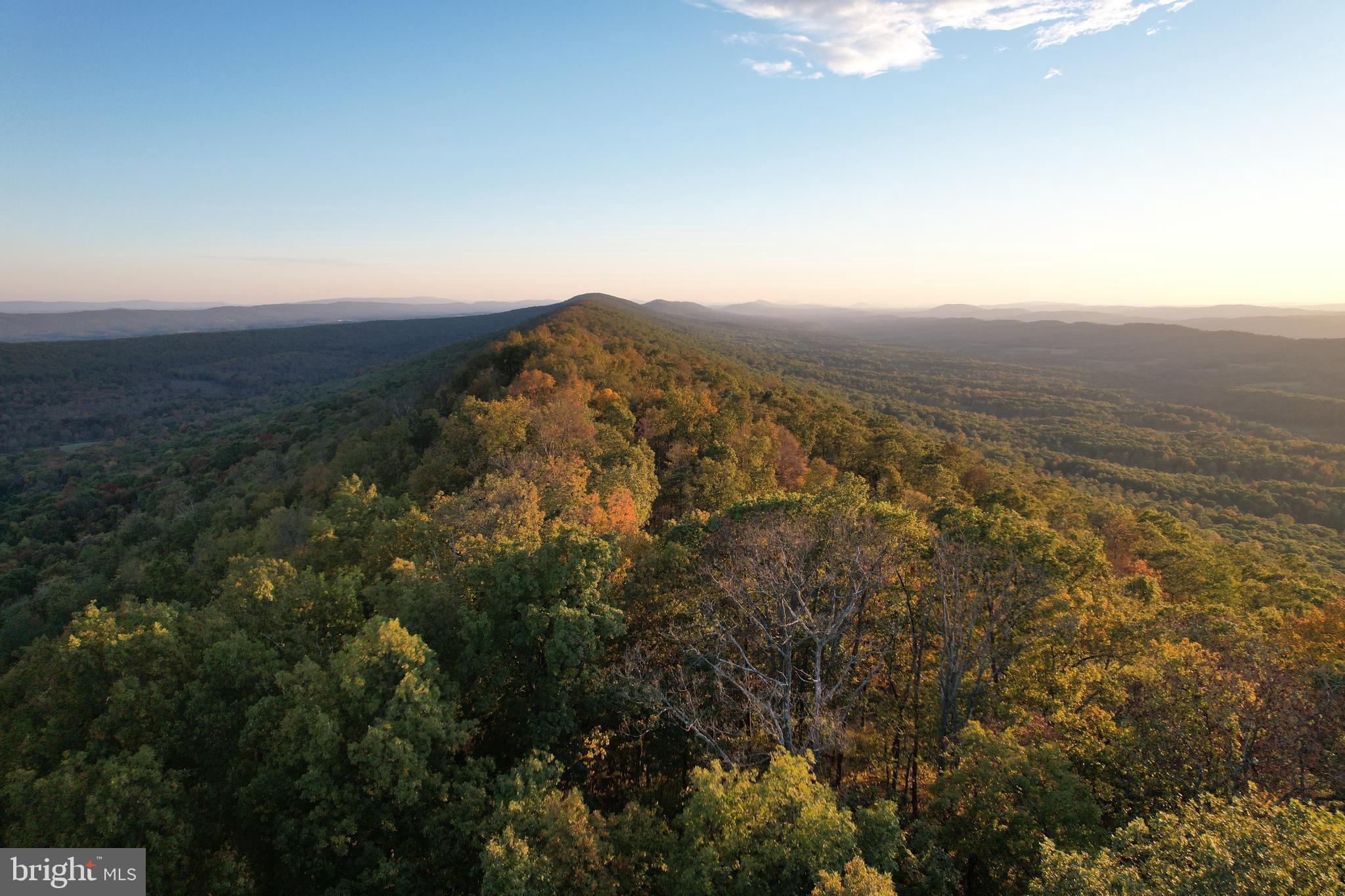 1790 Monroe Mountain Road Clearville, PA 15535 - Photo 4 of 7 an aerial view of house with yard and mountain view in back
