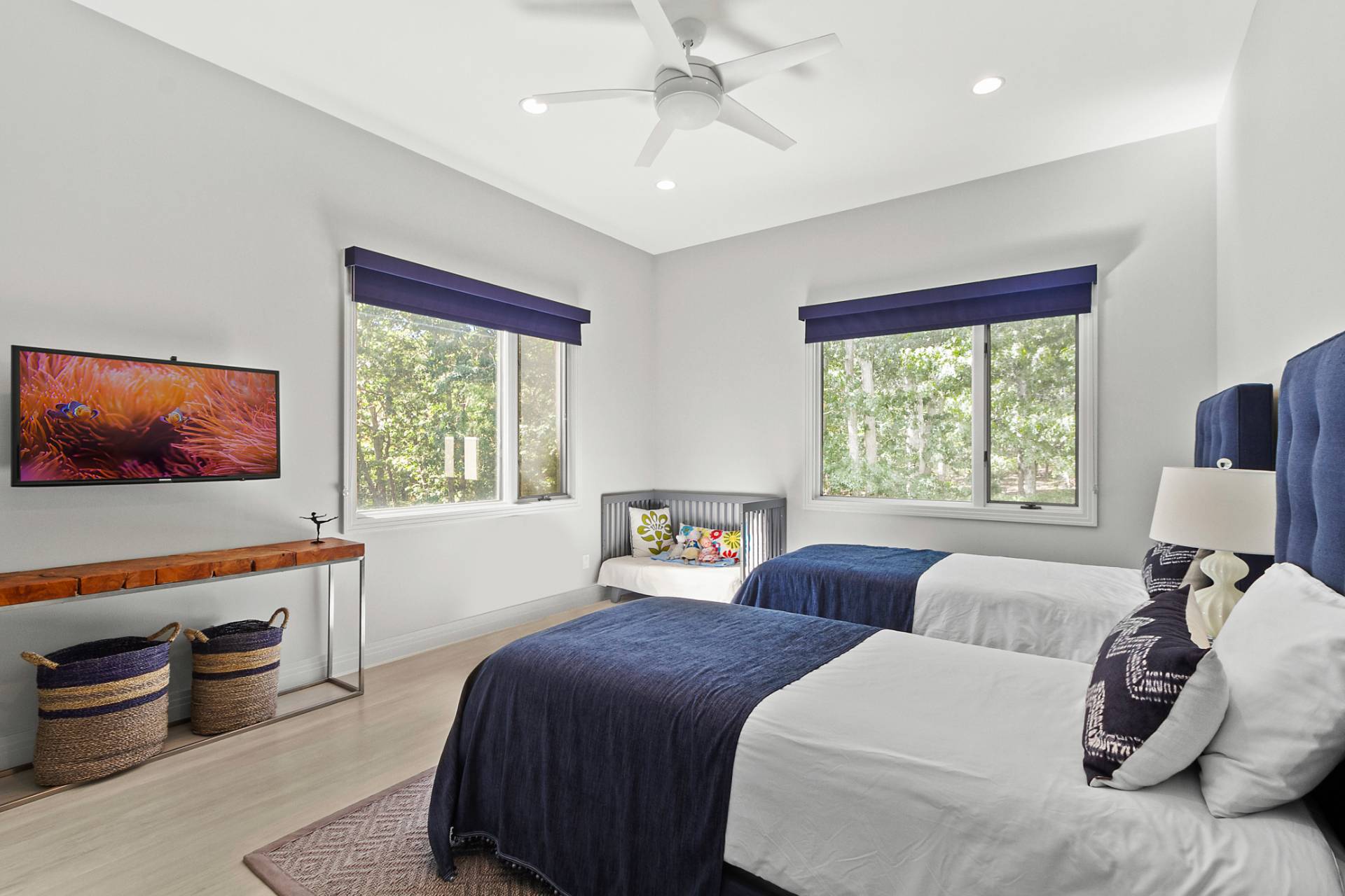 1705 Noyack Road Southampton, NY 11968 - Photo 12 of 16 a bedroom with two beds and a large window